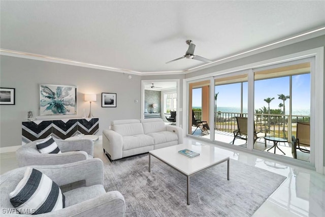 living area with baseboards and ceiling fan