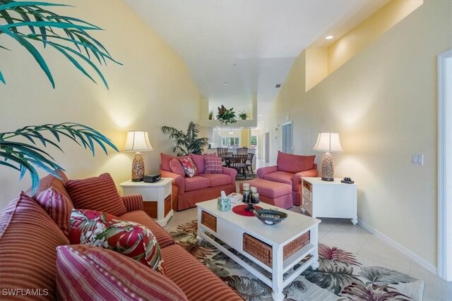 2381 Hidden Lake Ct Unit 8202, Naples, FL 34112 - living area with light tile patterned floors, baseboards, and lofted ceiling
