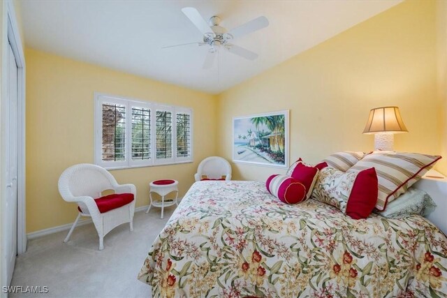 2381 Hidden Lake Ct Unit 8202, Naples, FL 34112 - bedroom with carpet floors, baseboards, a closet, a ceiling fan, and vaulted ceiling