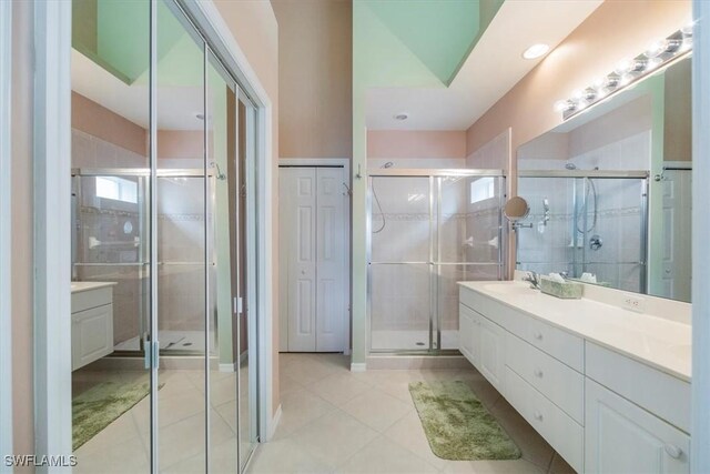 2381 Hidden Lake Ct Unit 8202, Naples, FL 34112 - full bathroom featuring double vanity, a stall shower, tile patterned flooring, and recessed lighting