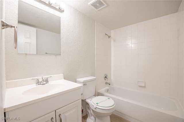 4605 Bayshore Dr Unit G6, Naples, FL 34112 - bathroom with a textured wall, vanity, and  shower combination