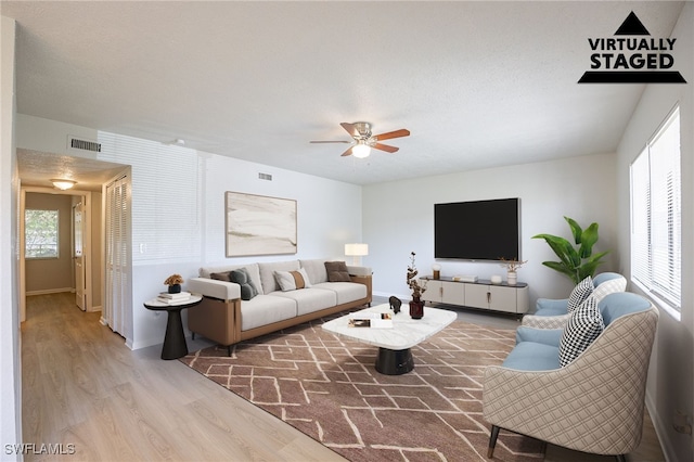 4605 Bayshore Dr Unit G6, Naples, FL 34112 - living room featuring wood finished floors and ceiling fan