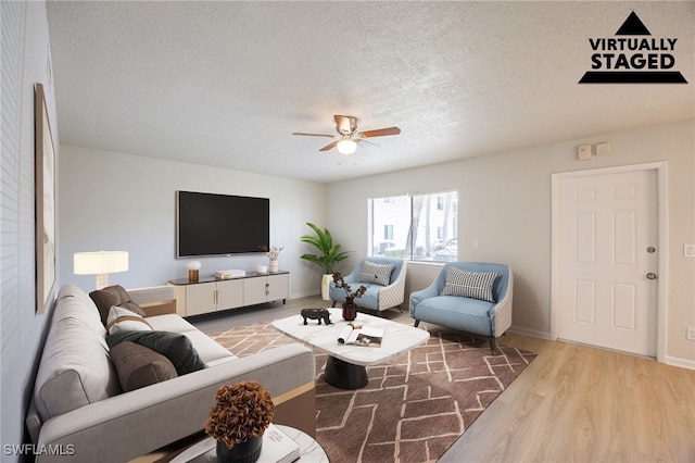4605 Bayshore Dr Unit G6, Naples, FL 34112 - living area featuring a ceiling fan, a textured ceiling, and wood finished floors