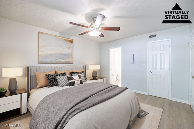 4605 Bayshore Dr Unit G6, Naples, FL 34112 - bedroom with light wood finished floors, ensuite bath, and a ceiling fan