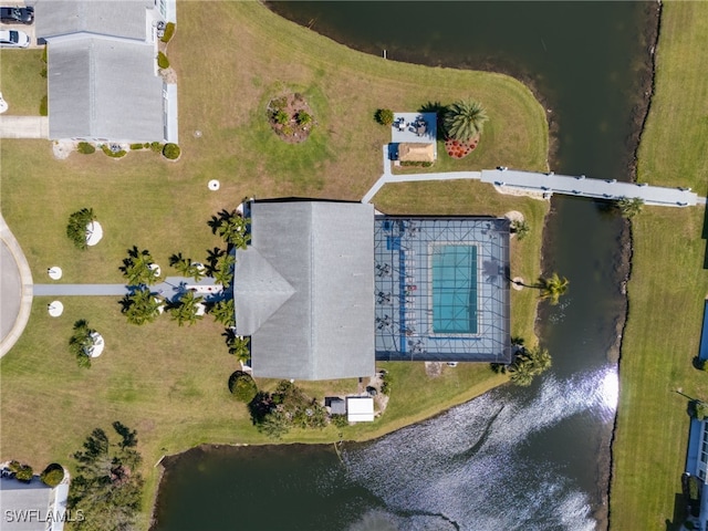 birds eye view of property with a water view