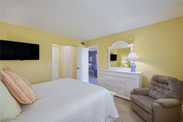 bedroom featuring visible vents and carpet flooring