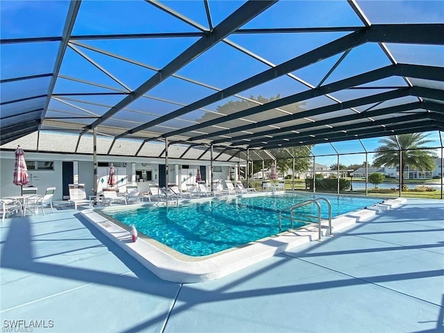 community pool with a lanai and a patio