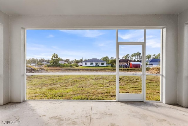 unfurnished sunroom with a wealth of natural light