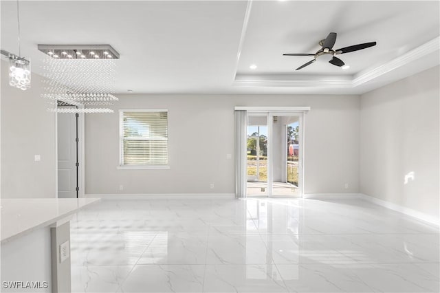 spare room featuring marble finish floor, a tray ceiling, recessed lighting, baseboards, and ceiling fan