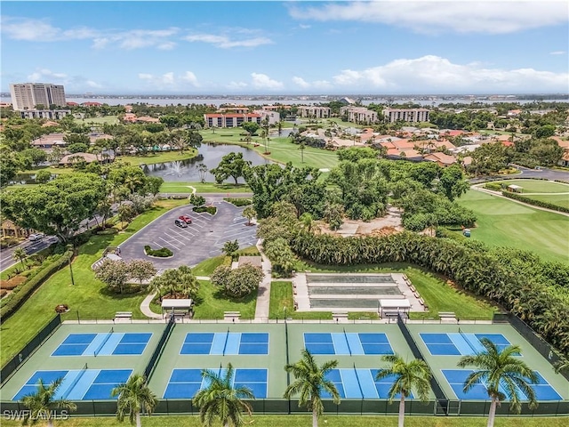 drone / aerial view featuring a water view and golf course view