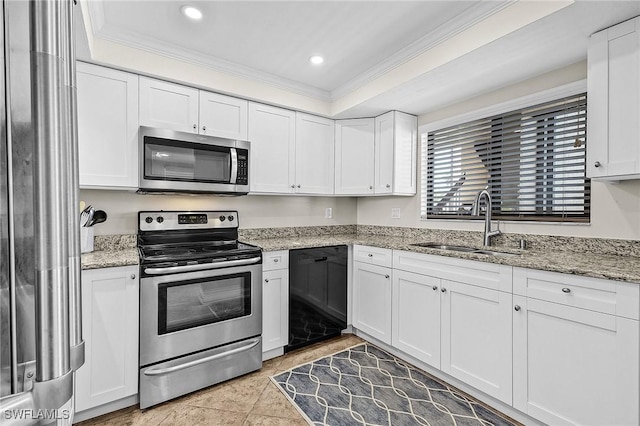 kitchen featuring stainless steel appliances, ornamental molding, and white cabinetry