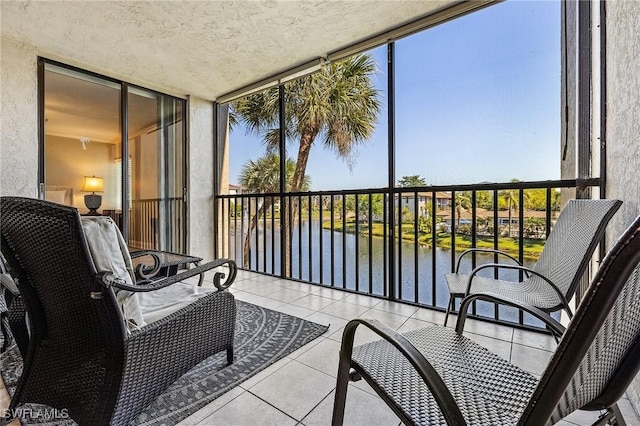 balcony featuring a water view