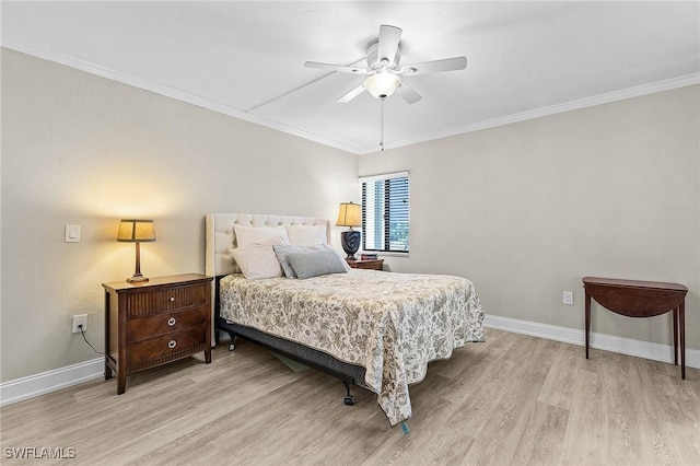 bedroom with baseboards, light wood-style floors, and ornamental molding