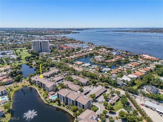 bird's eye view with a residential view and a water view