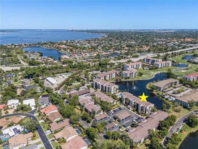 birds eye view of property with a residential view and a water view