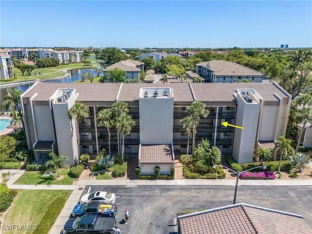 birds eye view of property with a residential view and a water view