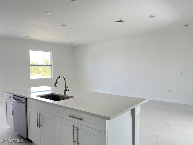 4309 8th St SW, Lehigh Acres, FL 33976 - kitchen with a sink, dishwasher, white cabinets, light marble finish floors, and a center island with sink