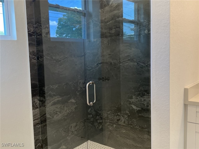 4309 8th St SW, Lehigh Acres, FL 33976 - full bath featuring a marble finish shower and a textured wall