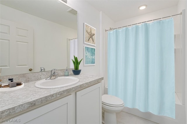 bathroom featuring vanity, shower / bath combination with curtain, and toilet