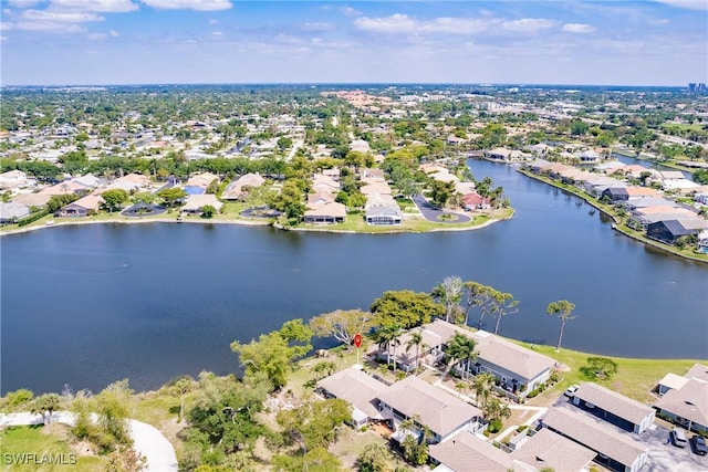 bird's eye view featuring a residential view and a water view