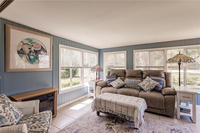 living room featuring light tile patterned floors and baseboards