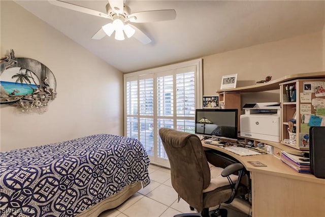 bedroom with light tile patterned floors, a ceiling fan, and vaulted ceiling