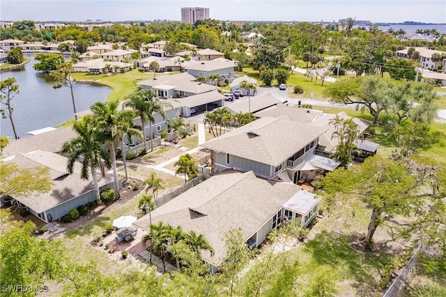 bird's eye view with a water view and a residential view