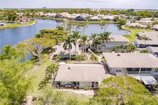 birds eye view of property featuring a residential view and a water view