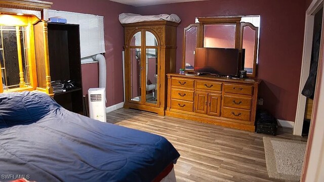 1280 Mcneill Rd, North Fort Myers, FL 33903 - bedroom featuring light wood-style flooring and baseboards