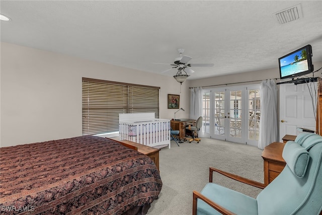 bedroom featuring a ceiling fan, visible vents, carpet floors, french doors, and access to outside