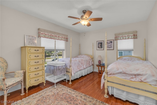 bedroom with ceiling fan and wood finished floors