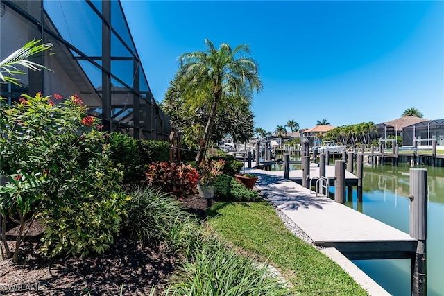 dock area featuring a residential view, a water view, and a lanai