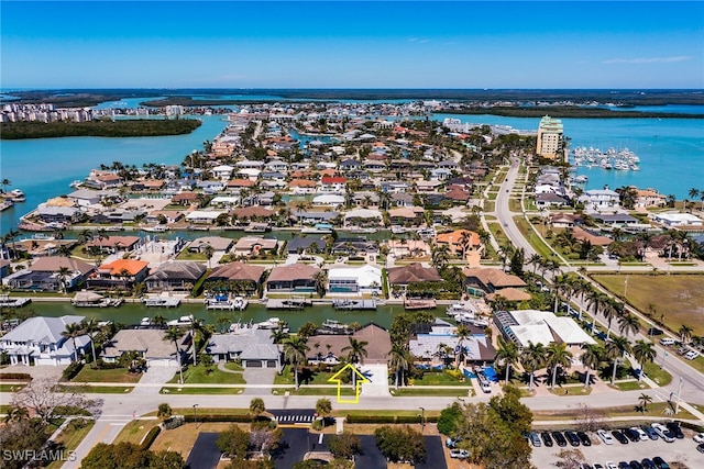 birds eye view of property with a residential view and a water view