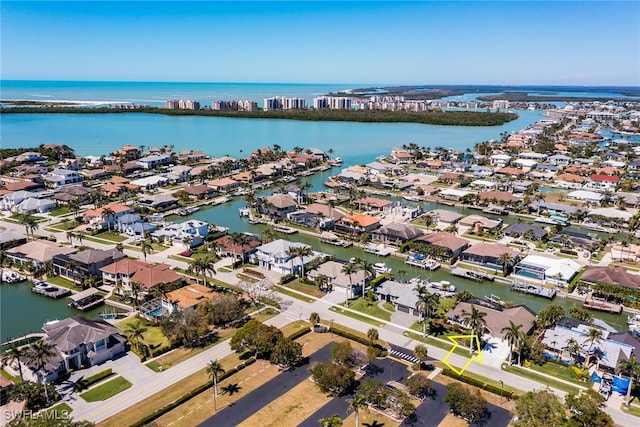 bird's eye view featuring a residential view and a water view