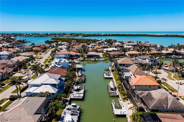 aerial view with a residential view and a water view