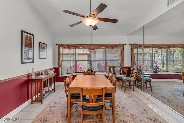 dining room featuring vaulted ceiling, plenty of natural light, a ceiling fan, and visible vents