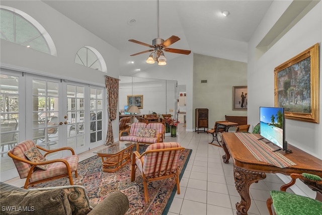 living area with high vaulted ceiling, light tile patterned flooring, french doors, and ceiling fan