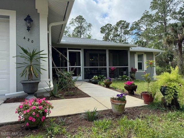 420 20th Ave NW, Naples, FL 34120 - view of exterior entry featuring stucco siding