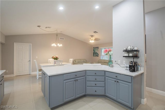 420 20th Ave NW, Naples, FL 34120 - kitchen with light countertops, a peninsula, vaulted ceiling, ceiling fan, and decorative light fixtures