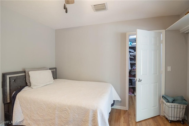 420 20th Ave NW, Naples, FL 34120 - bedroom with light wood-type flooring and ceiling fan