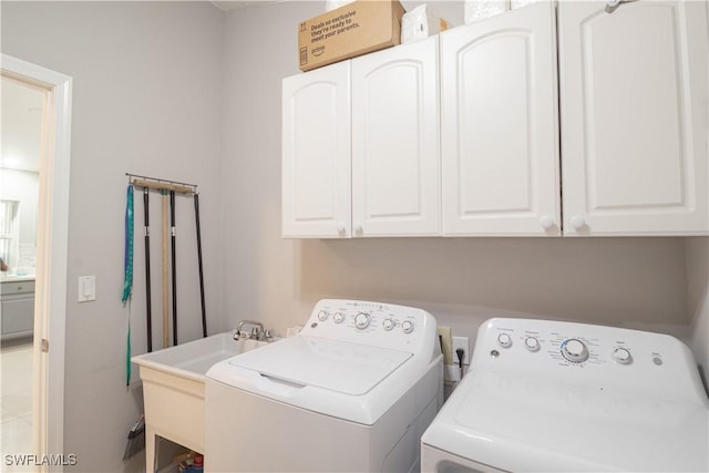 420 20th Ave NW, Naples, FL 34120 - washroom featuring washer and dryer and cabinet space