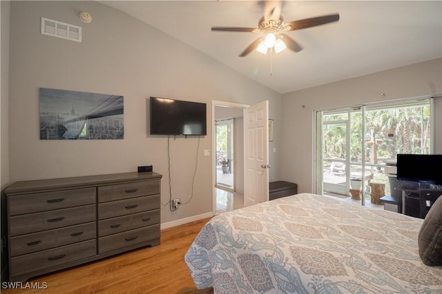 420 20th Ave NW, Naples, FL 34120 - bedroom featuring vaulted ceiling, access to outside, light wood-type flooring, multiple windows, and baseboards