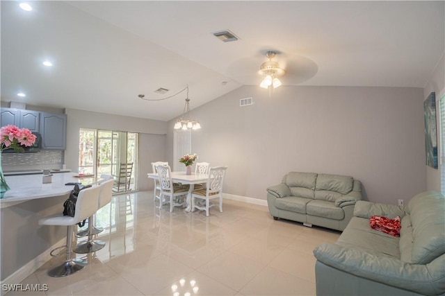 420 20th Ave NW, Naples, FL 34120 - living room featuring baseboards, lofted ceiling, light tile patterned flooring, recessed lighting, and ceiling fan