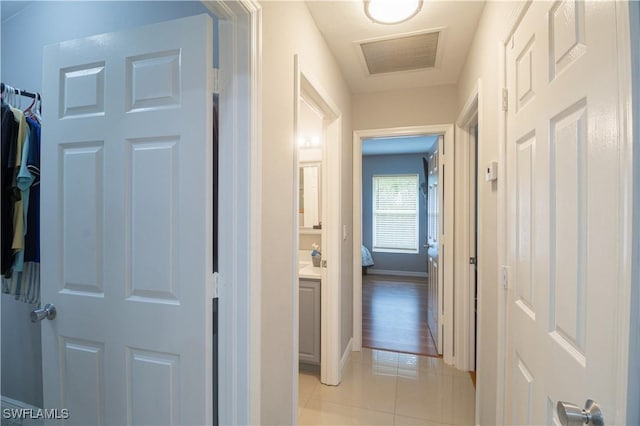 420 20th Ave NW, Naples, FL 34120 - corridor with light tile patterned flooring and baseboards