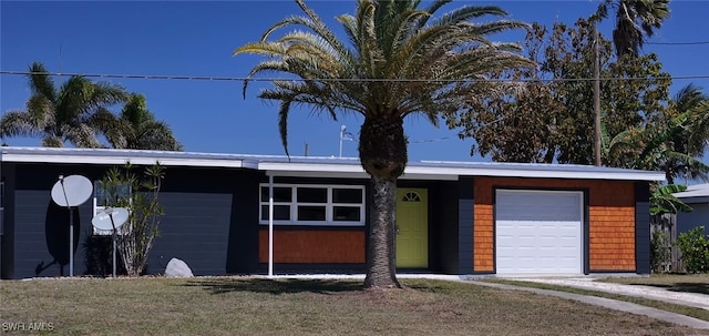 125 Palmetto Cir NE, Port Charlotte, FL 33952 - single story home featuring a garage
