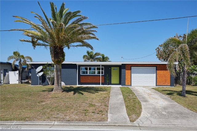 125 Palmetto Cir NE, Port Charlotte, FL 33952 - mid-century modern home featuring an attached garage and concrete driveway