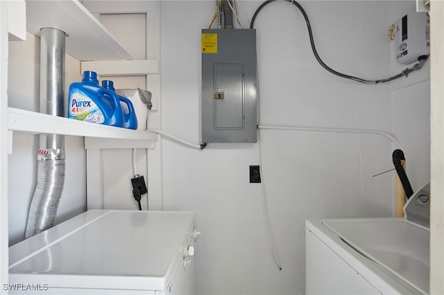 125 Palmetto Cir NE, Port Charlotte, FL 33952 - washroom with electric panel and washing machine and dryer
