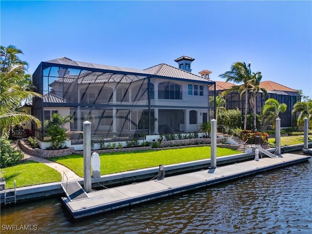 4831 Conover Ct, Fort Myers, FL 33908 - view of dock featuring glass enclosure, a water view, and a yard