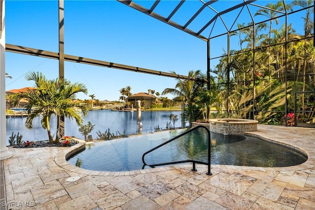4831 Conover Ct, Fort Myers, FL 33908 - view of pool featuring a pool with connected hot tub, a lanai, a water view, and a patio area