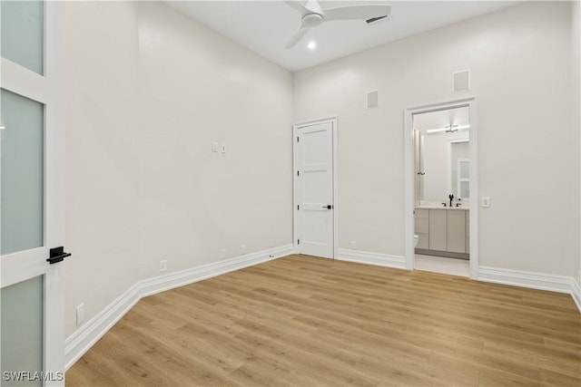 4831 Conover Ct, Fort Myers, FL 33908 - unfurnished bedroom with baseboards, light wood-type flooring, and a sink